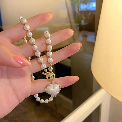 Elegant Pearl Beaded Necklace with Rhinestone Heart Pendant